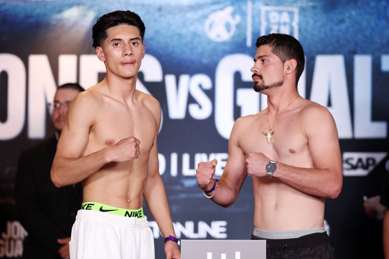 Anel Dudo and Jose Medrano Jr pose during the official weigh-in ahead of their super featherweight bout in San Jose.