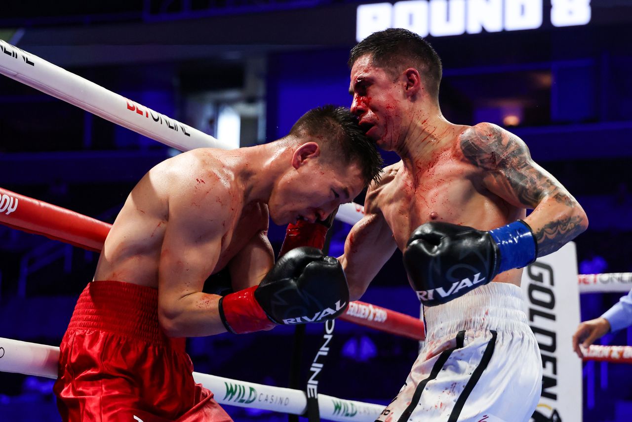 Enkhmandakh Kharkhuu and Adrian Yair Ibarra Herrera exchange punches at close range during their flyweight bout.
