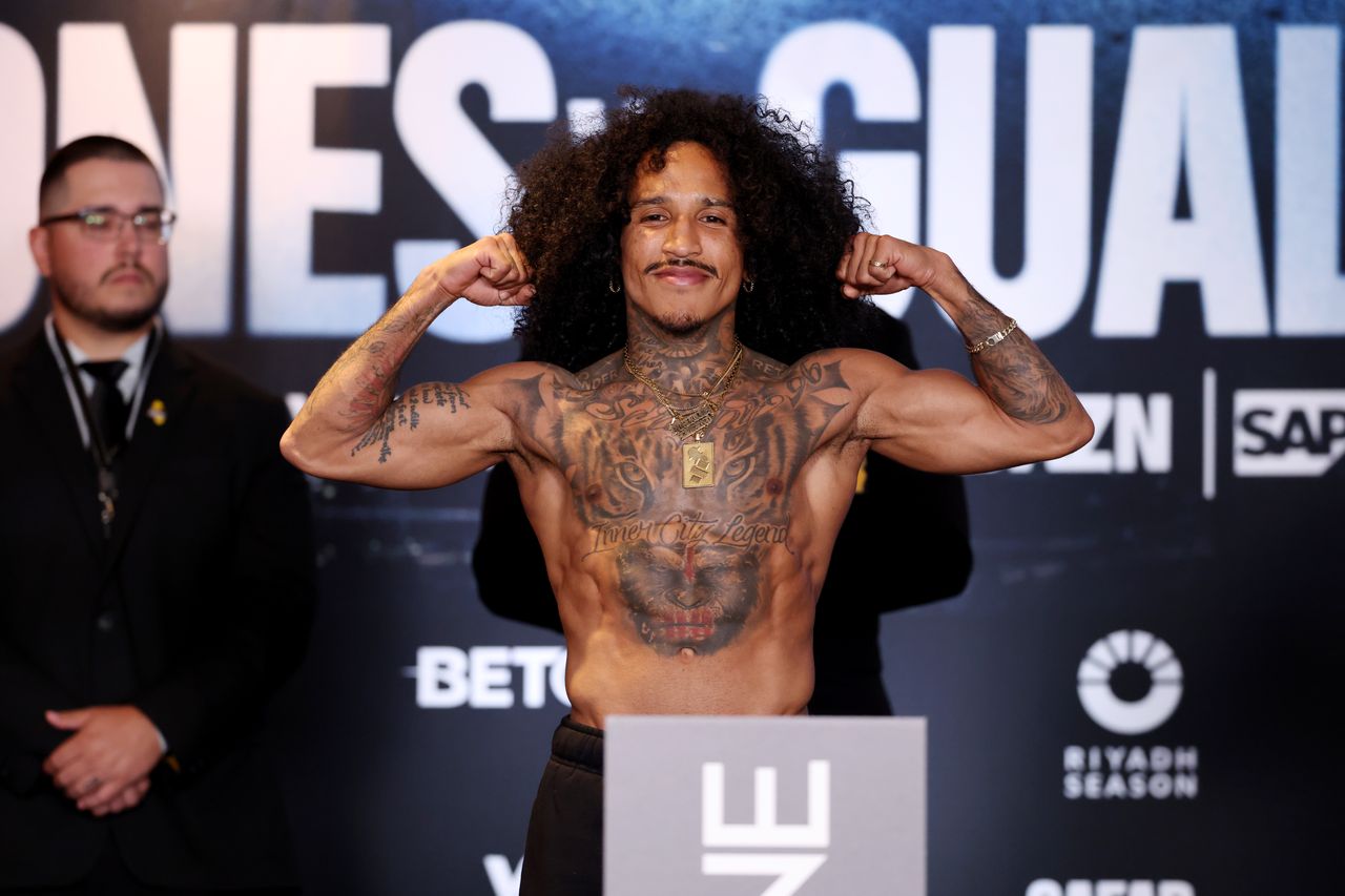 John Ramirez flexes on the scales during the official weigh-in ahead of his fight against Lucas Emanuel Fernandez.