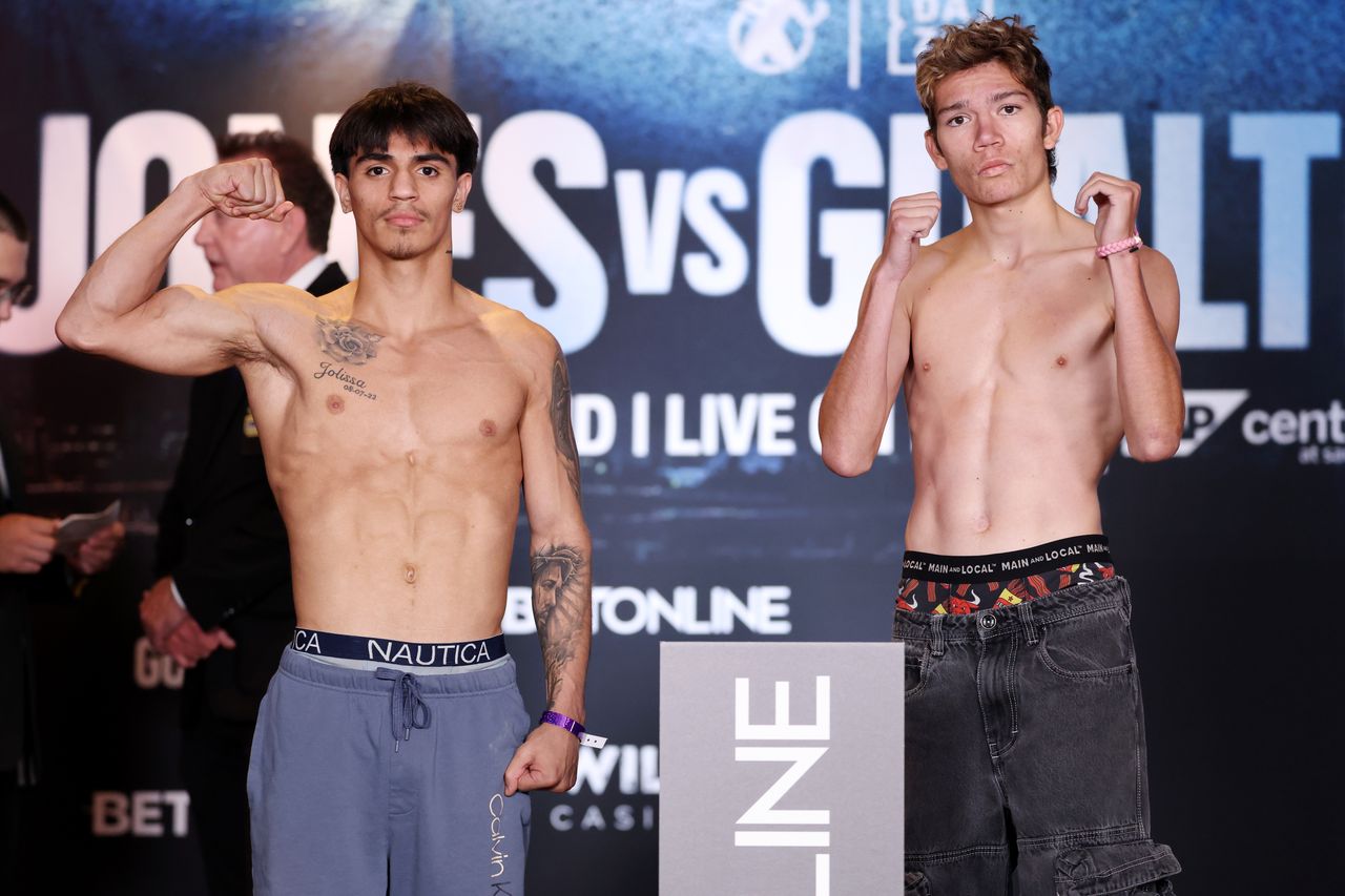 Jordan Fuentes and Dante Evana Hemandes pose during the official weigh-in before their super flyweight bout in San Jose.