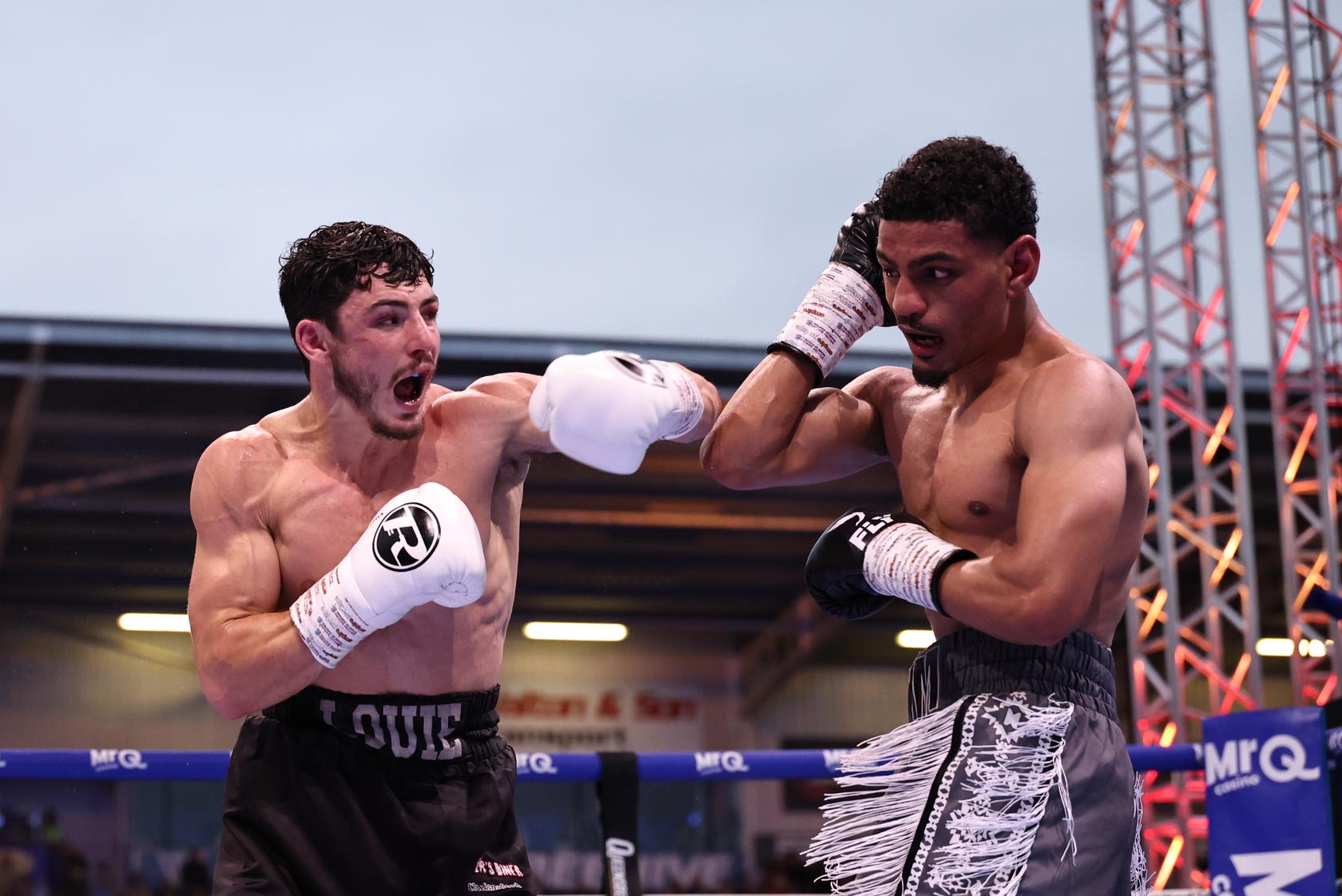Louie O'Doherty throwing a punch at Ahmed Hatim during their lightweight title clash on the Queensberry card.