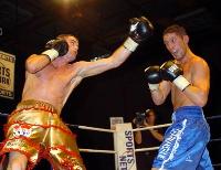 thumb Thomas McDonagh launches a big left at Darren Rhodes14 Boxing Photos: Barnes vs Hare and Undercard